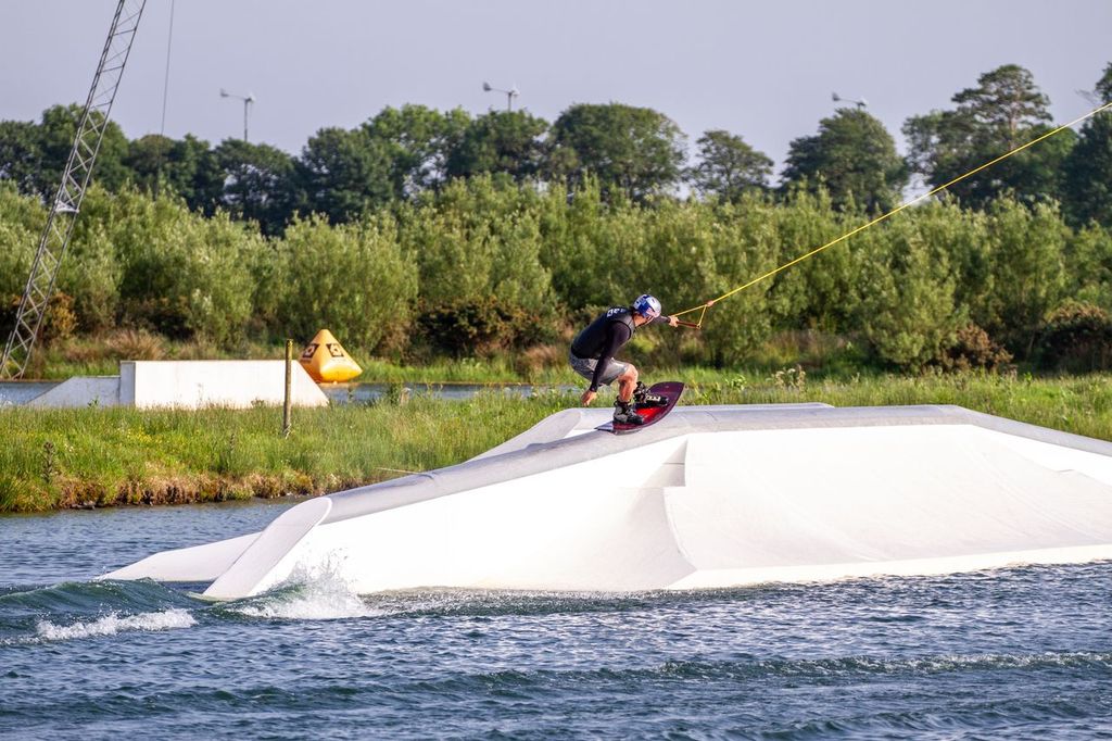 A Ronix rider on an obstacle at a cable wakepark